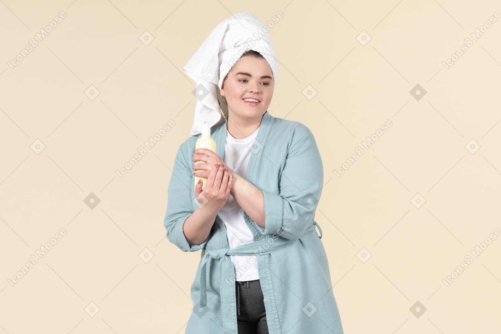 Young plus-size girl in a blue bathrobe taking care of her skin after a shower