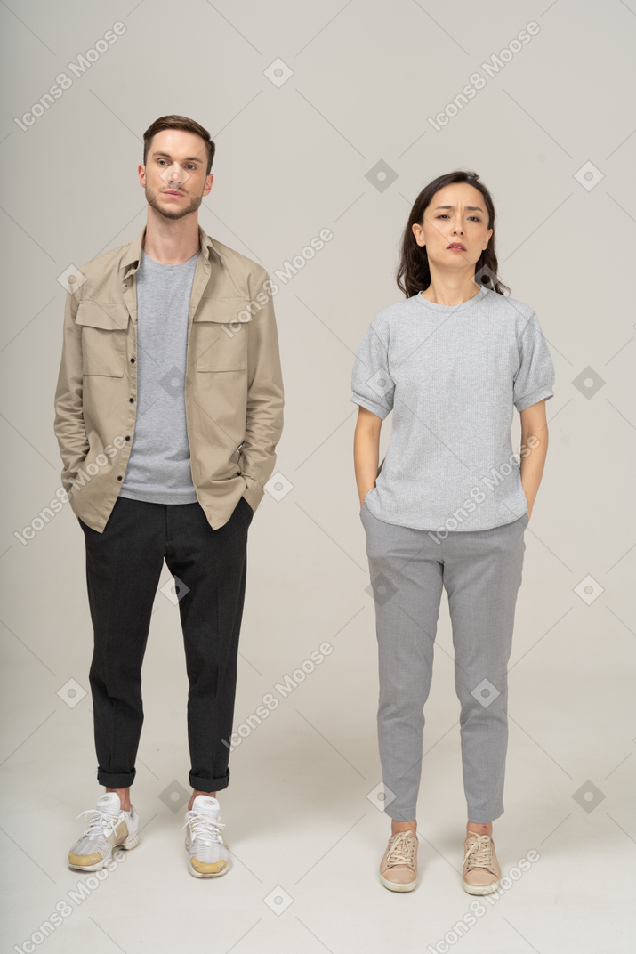 Front view of young couple being annoyed