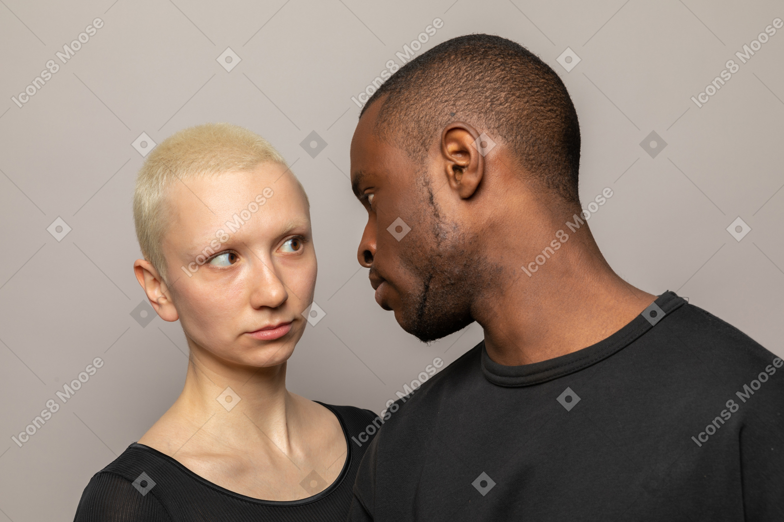 Mad international couple looking at each other