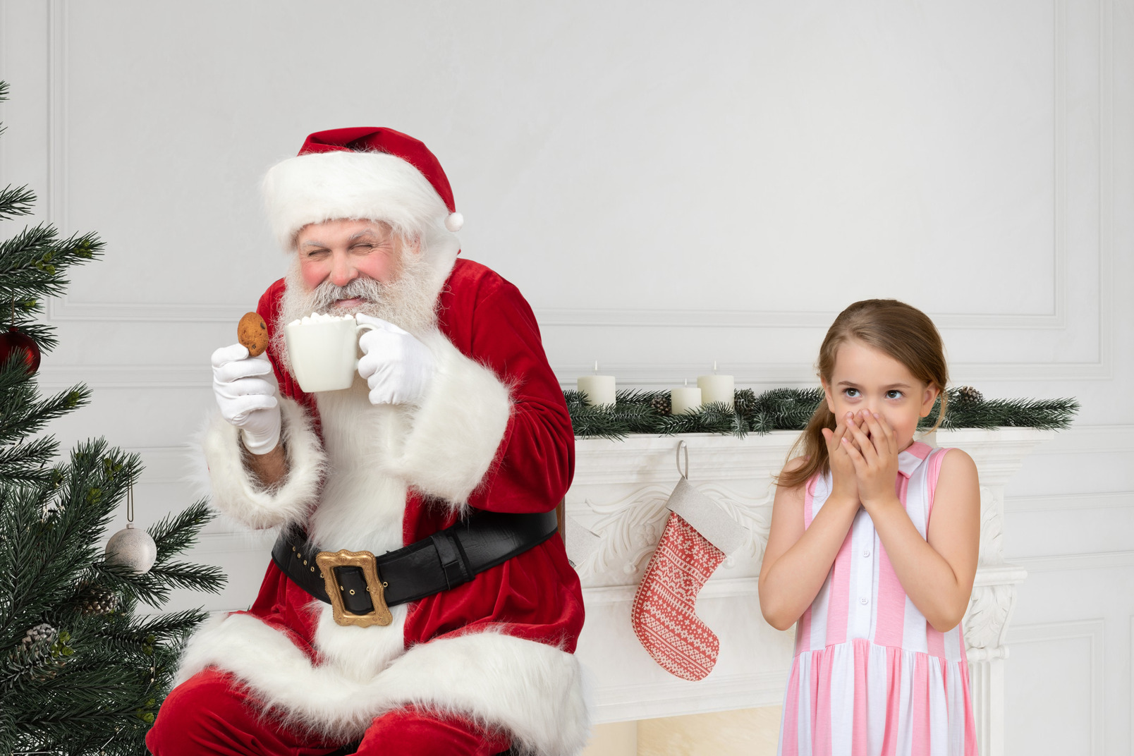 Little girl has found santa drinking tea