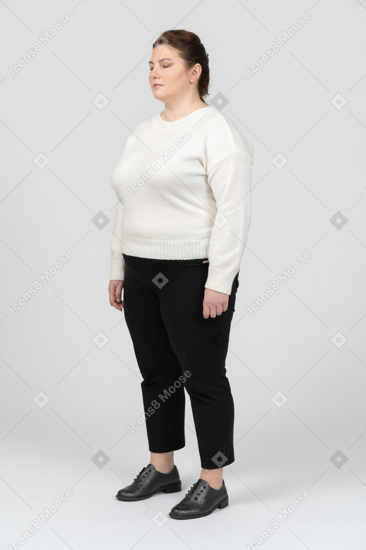 Plump woman in casual clothes standing