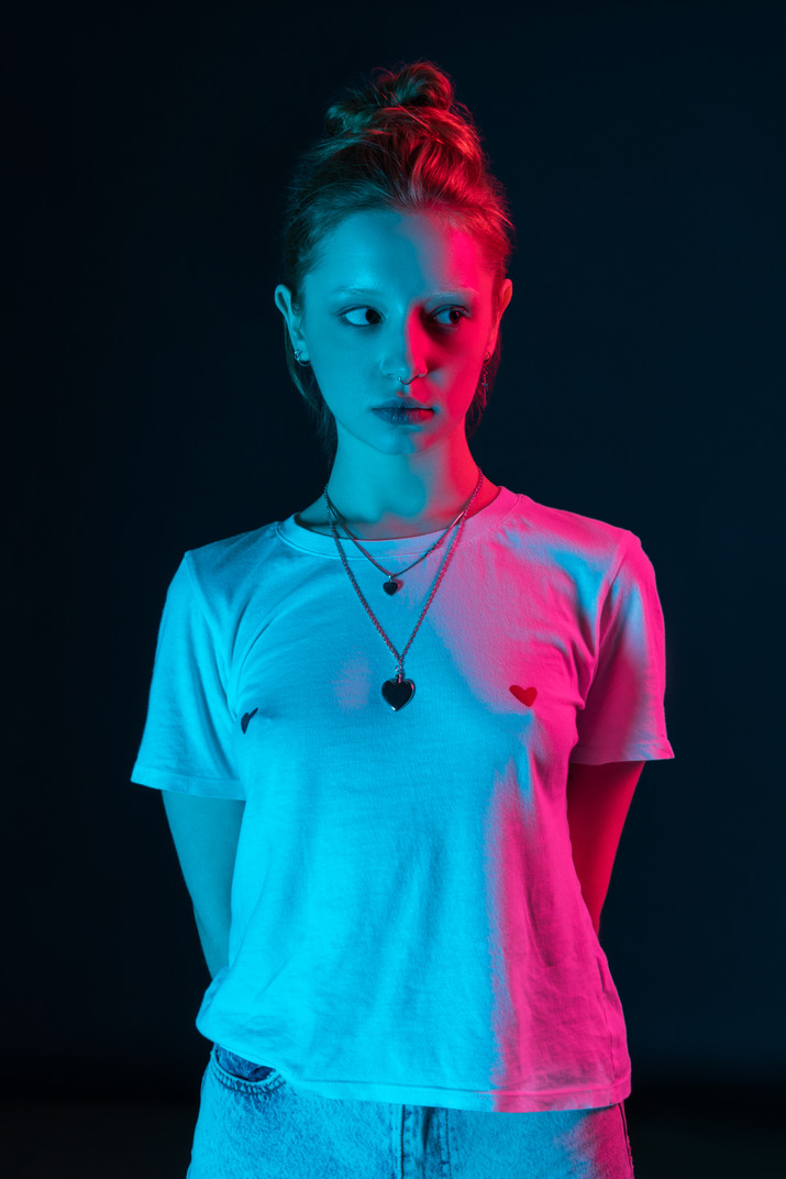 Straight portrait of female model under neon lights