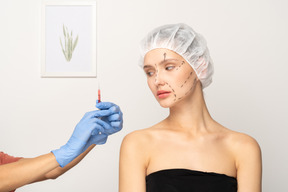 Young woman about to get botox injection