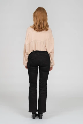 Back view of young woman standing