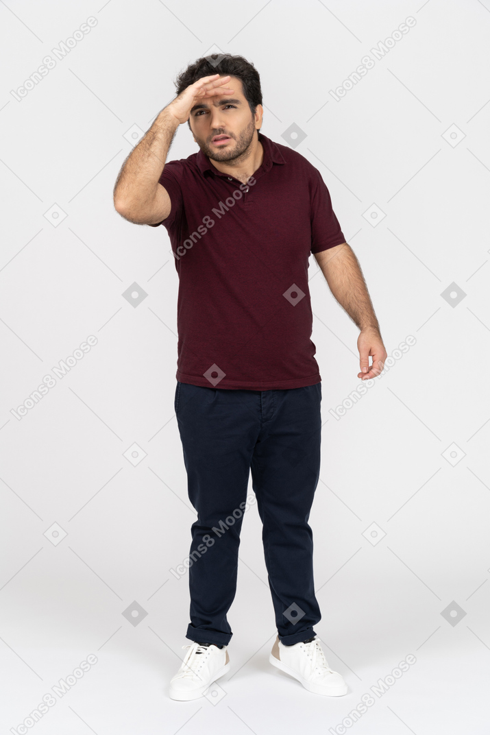 Man in casual clothes looking far ahead