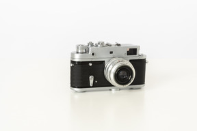 Photo camera on a white background