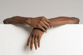 Human hands holding styrofoam board