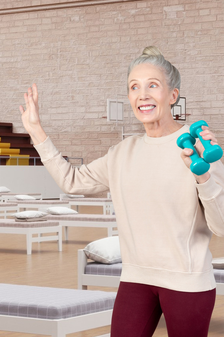 A woman holding a bowling ball in her hand