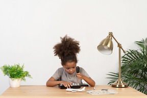 Cute girl trying to repair an device