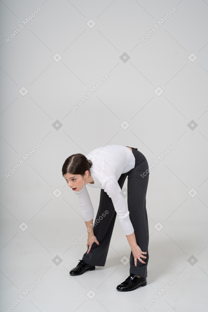 Young woman bending down