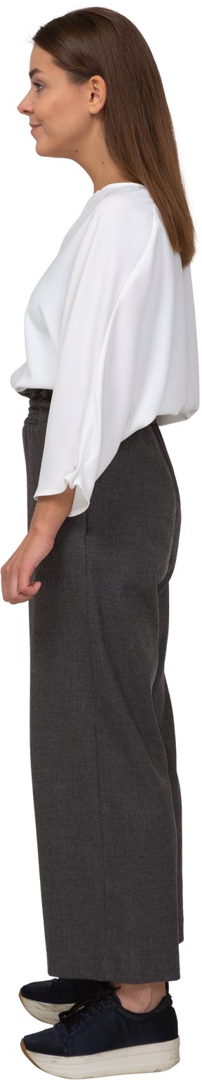 Side view of a young lady in office clothing looking aside