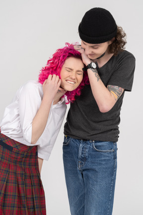 Student couple smiling while cuddling