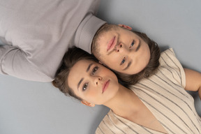 Overhead shot of a young couple looking up