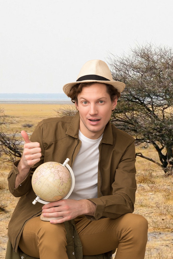 Man looking at a globe