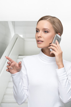 A woman is talking on a cell phone