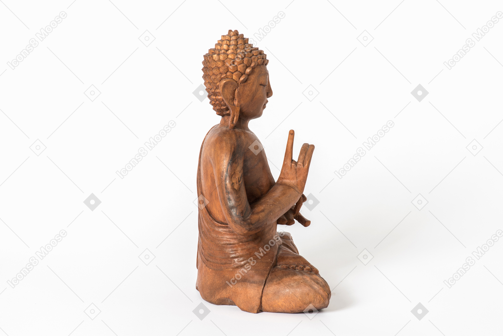 Buddha statue placed in profile on white background