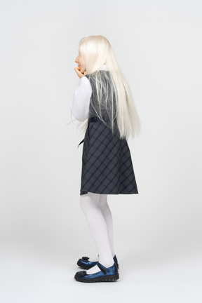 Back view of a girl in school uniform