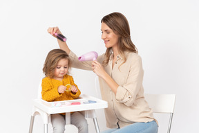 I love blow drying and style her hair