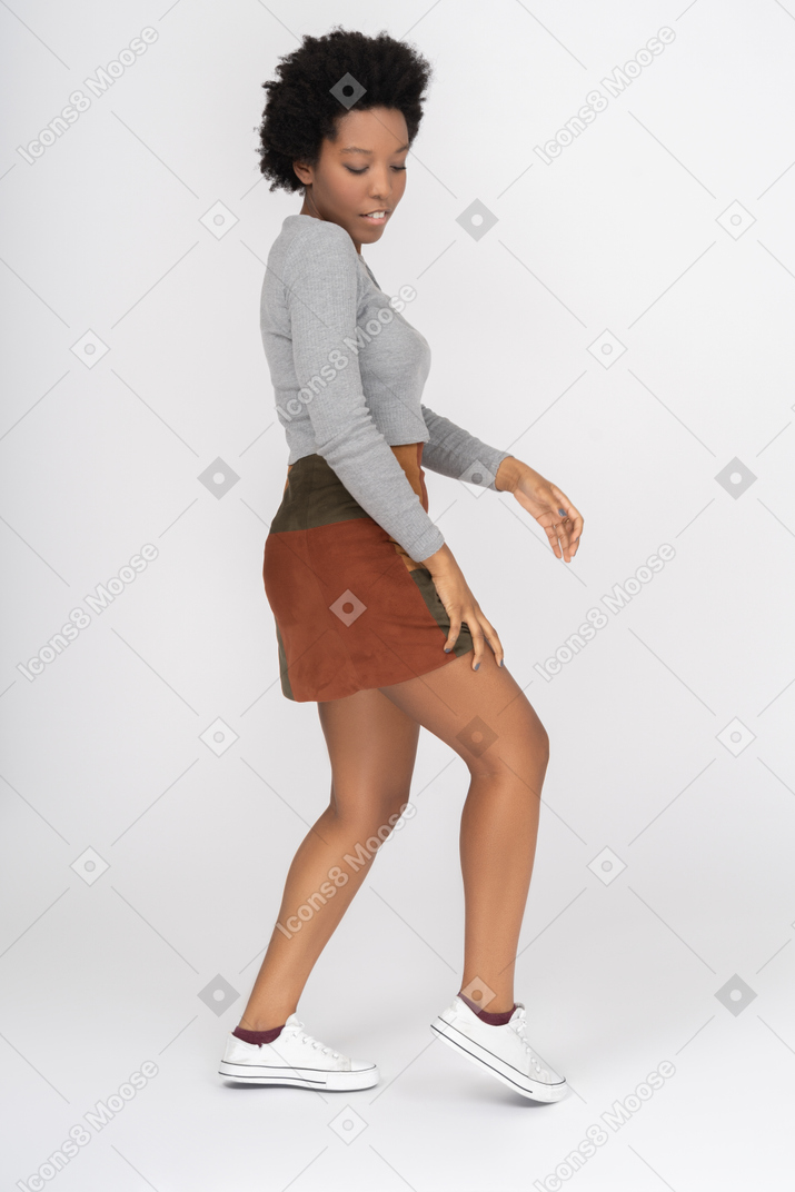 Tender african girl posing sideways