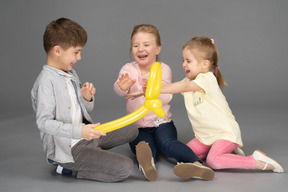 Happy children playing with balloon