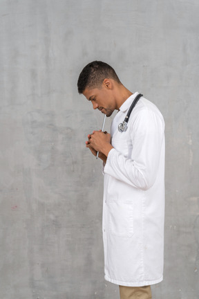 Side view of a solemn-looking doctor
