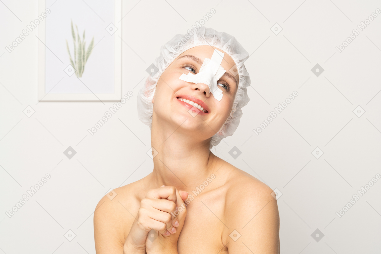 Smiling female patient with bandage on her nose