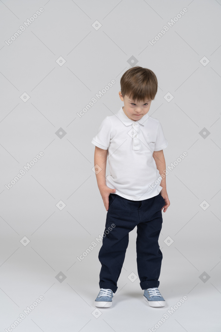 Front view of little boy looking determined