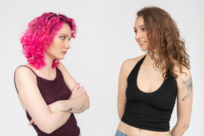 Two young women looking at each other