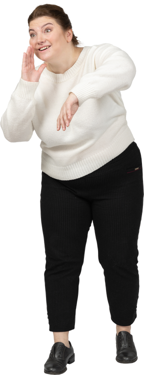 Front view of a plus size woman in casual clothes calling someone