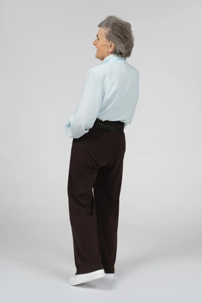 Three-quarter back view of an old woman