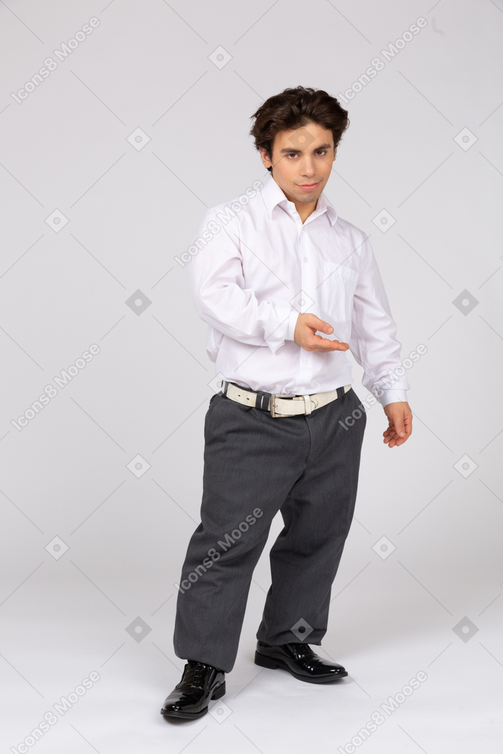 Young office worker holding his hand out