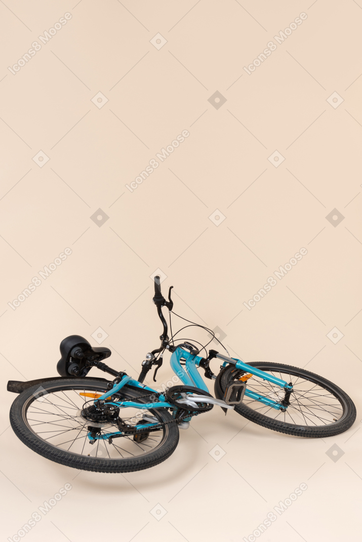Blue bicycle left on the floor