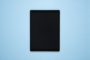 Digital tablet over blue background