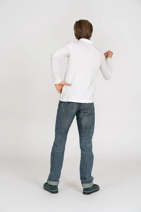 Young man in casual clothes standing