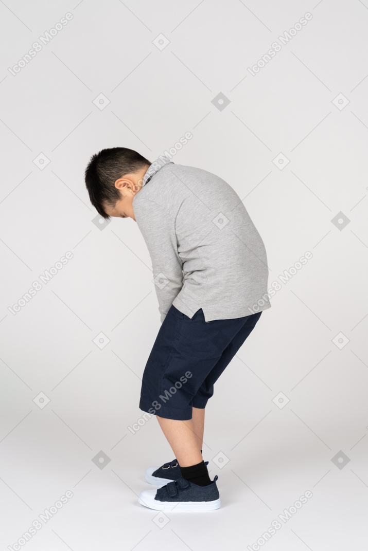 Boy holding his leg