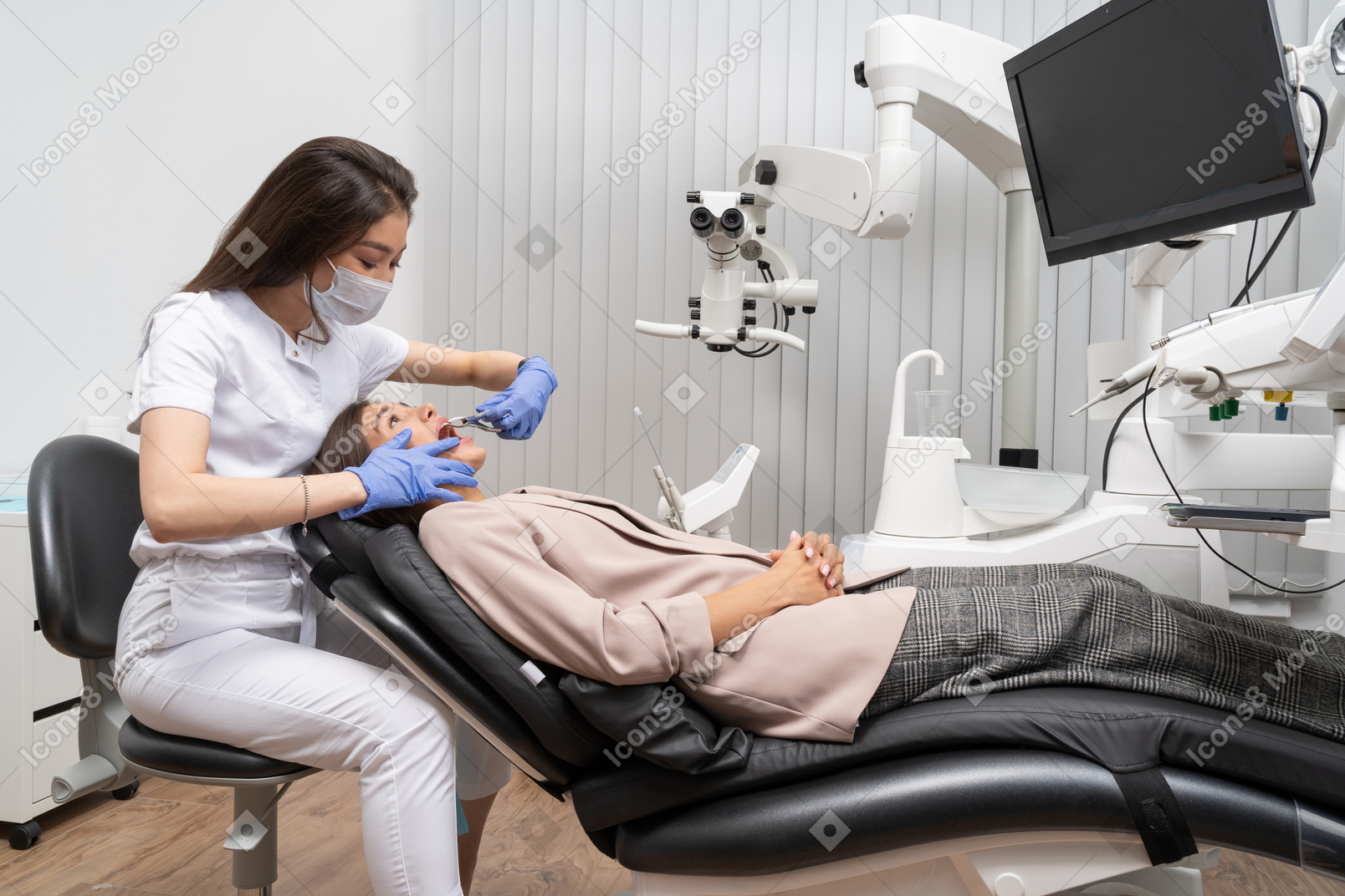 Full-length of a female dentist enjoying the process of examining her patient