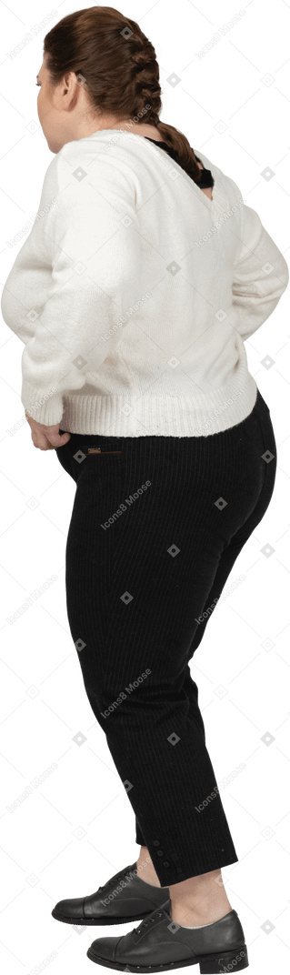 Plus size woman in casual clothes posing
