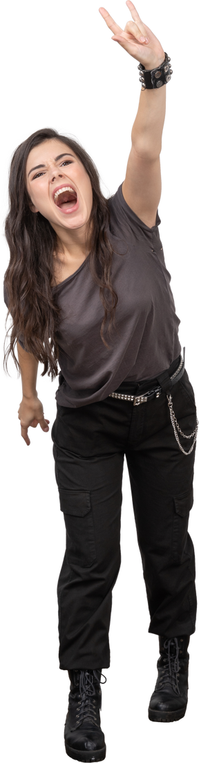 Front view of a screaming. female rocker outstretching her hand