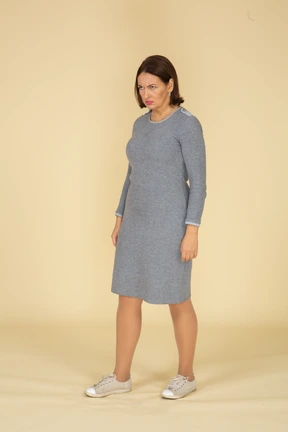 Side view of a woman in grey dress