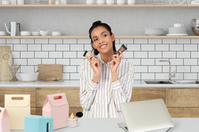 Woman holding foundation tubes