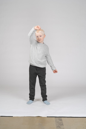 Little boy raising his fist
