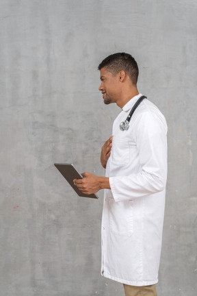 Side view of a male doctor talking