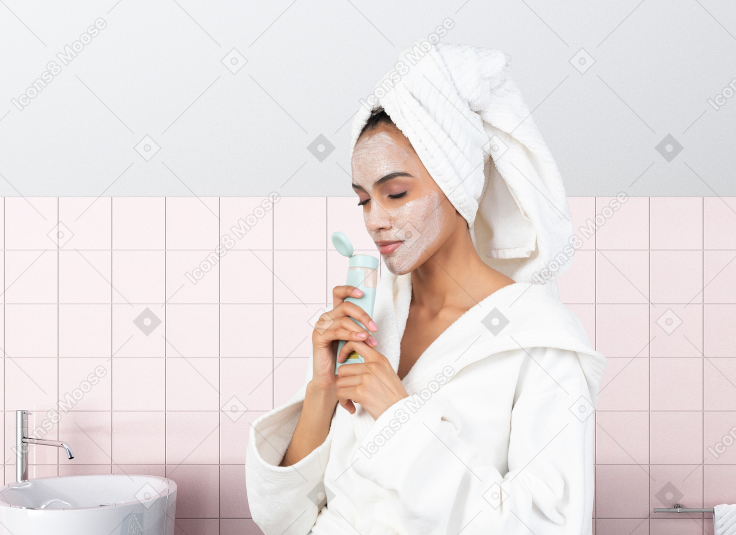 A woman with a towel on her head smelling face cream