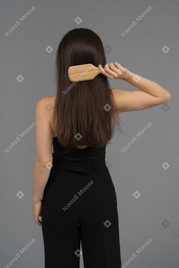 Woman combing her hair