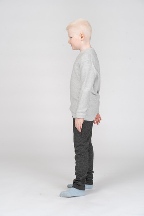 Side view of a little boy standing