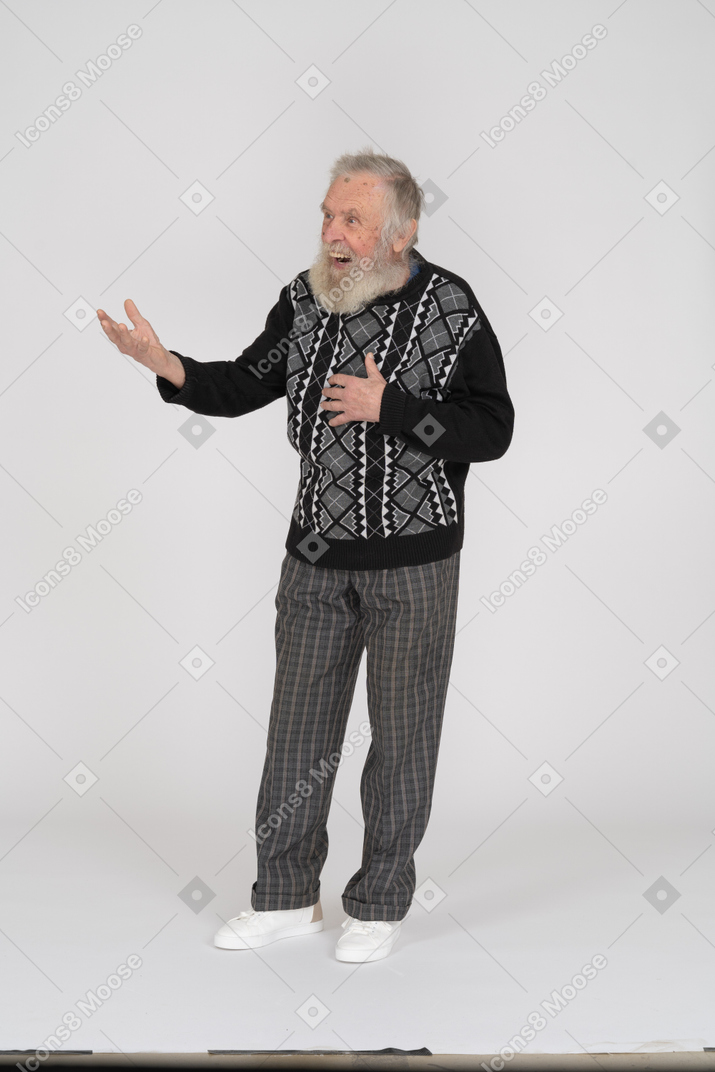 Elderly man holding his hand on his chest