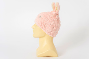 Pink bunny hat on a mannequin head