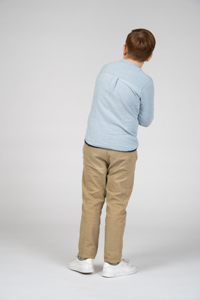 Boy standing back to camera