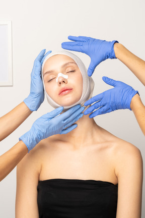 Female patient with hands next to her face