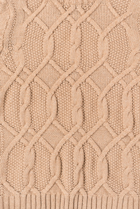 Beige gestrickte decke